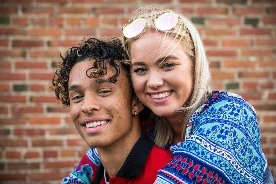 A young couple looking happy together
